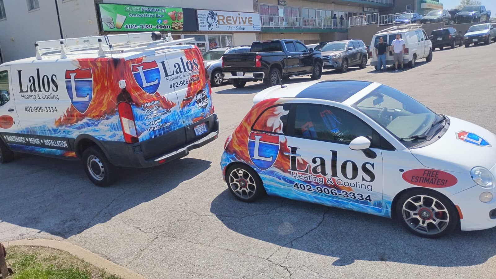 Lalos Heating & Cooling van and car wraps installed by Impress