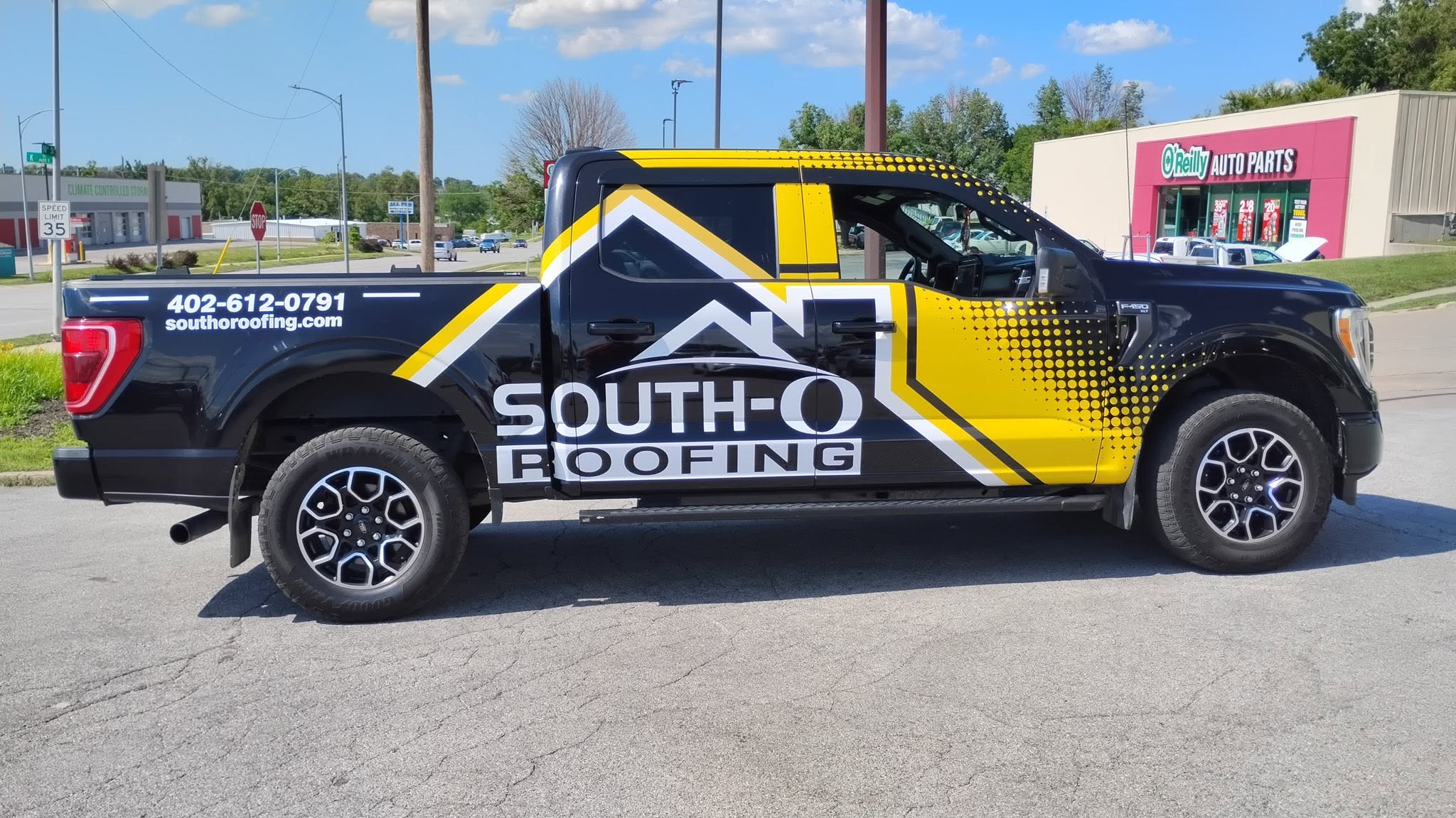 South-O Roofing pickup truck wrap installed by Impress